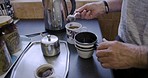 Senior man, hands and tea cup on kitchen of house or nursing home for breakfast detox, morning hot drink or relax countertop beverage. Retirement elderly, mug and sugar for coffee on breakfast table