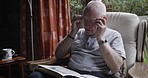 Reading, home and senior man with glasses enjoy freedom, retirement and leisure activity on weekend.  Relax, peace and elderly man with eyewear for reading book, literature and novel in nursing home