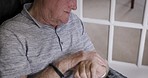 Relax, wristwatch and retirement with a senior man checking the time on a sofa in the living room of his home. Thinking, pensioner and watch with an elderly male sitting in his lounge in the house