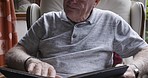 Books, reading and senior man on sofa in home living room relaxing alone. Fiction novel, peace and retired elderly male from Canada studying literature, love or fantasy story on chair in house lounge
