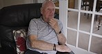 Thinking, sad and relax with old man on sofa feeling lost, confused and depression. Mental health, lonely and retirement with elderly guy in living room at home for problem, mistake and frustrated