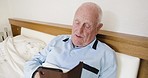 Retirement, old man and phone text in bed while browsing social media online for news in the morning. Retired man, cellphone and scrolling the internet for funny meme while lying in bed 