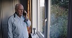 Angry senior man, phone call and communication, conversation and home feeling anger from conflict. Elderly male, hang up or contact with a person on mobile smartphone in house, frustrated and annoyed