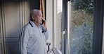Retired man, window and call in pajamas in the morning for wifi communication in his retirement home. Senior male, phone call and conversation on a smartphone while enjoying the bedroom view
