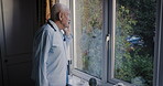 Morning, retirement and phone call of man in home with communication, update or news in Australia. Health, pension and elderly person talking on smartphone while checking street activity at window.