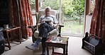 Senior man, relax and phone on sofa, social media and text message, chair and retirement life in home. Elderly male, reading message and 5g mobile smartphone in living room, retired and pensioner