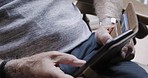 Closeup, senior man and hands with phone for communication, typing and social media in home. Zoom, elderly male and smartphone for digital chatting, email and social network on internet, app and web