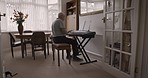 Senior man, piano and playing notes for practice, happy or enjoy retirement in living room. Retired, mature male or pianist training, happiness or have fun with hobby, studying music or relax in home