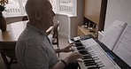 Piano, musician or old man reading music training for a senior artistic classical performance at home in Berlin Pianist, talented and elderly person enjoys playing a song for practice in retirement 
