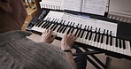Music, keyboard and senior man playing with sheets of paper for practice, lesson or entertainment at home. Hobby, retirement and elderly guy with song from musical book to play on the piano in house.