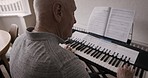 Piano, senior man and keyboard music of a elderly person with classical musician training at home. Retirement, nursing home and creative playing of a old adult play and press a note for sound