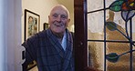 Senior man, open door and welcome in home, happy smile and portrait with pov, talking and guest at entrance. Elderly male, retired and retirement in house, speaking and happiness to greet in doorway