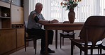 Home, blood pressure and senior man with medical kit to examine, check and monitor heart rate in retirement home. Healthcare, stroke rehabilitation and elderly male with hypertension machine on arm