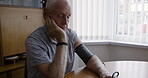 Senior man, stress or blood pressure test in house or nursing home in healthcare life insurance or medical wellness. Retirement elderly, cardiovascular cholesterol or heart check on cardiac equipment