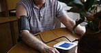 Healthcare, blood pressure and check with old man at table for heart, hypertension or monitor sickness. Retirement, medical and inspection with senior patient and diagnosis for cardiovascular disease