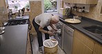Old man doing laundry, washing machine and cleaning clothes, fabric and housekeeping for net, tidy and fresh apartment. Senior guy, laundry basket and tumble dryer, home appliance and lifestyle chore