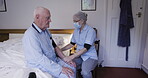 Senior man, blood pressure and nursing home for retirement healthcare service, disability support and covid caregiver. Diabetes, hypertension test and elderly patient with medical nurse in bedroom