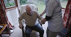 Retirement, nurse and senior man in chair for healthcare, disability assistance and medical support. Living room, nursing home and caregiver helping sick, disabled and elderly patient from couch