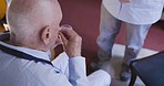 Pills, senior care and man with medical drugs in a nursing and retirement home with support. Healthcare, medical help and living room of an elderly person with water and vitamin supplement for health