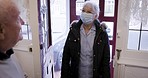 Opening door, morning and senior man with carer for healthcare, medical help and consultation. Welcome, covid and an elderly man with a home nurse helping with health and housework during retirement