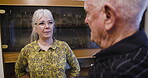 Love, retirement and talk with a senior couple in the living room of their home chatting together. Security, trust and support with a mature man and woman enjoying conversation while bonding