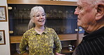Love, retirement and chat with a senior couple in the living room of their home talking together. Security, trust and support with a mature man and woman enjoying conversation while bonding
