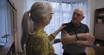 Love, retirement and chatting with a mature couple in the living room of their home talking together. Security, trust and support with a senior man and woman enjoying conversation while bonding