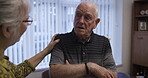 Love, retirement and talking with an old couple in the living room of their home chatting together. Security, trust and support with a senior man and woman enjoying conversation while bonding