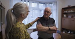 Love, retirement and chatting with an old couple in the living room of their home talking together. Security, trust and support with a senior man and woman enjoying conversation while bonding