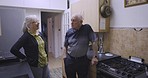 Love, relax and senior couple talking in a kitchen, happy and smile while bonding in their home. Elderly, woman and man speaking, laughing and enjoying retirement, morning and relationship indoors