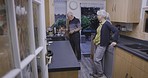Elderly discussion, kitchen and senior couple talking by a stove ready for cooking dinner at home. House, marriage and retirement of old people with communication and care together with happiness