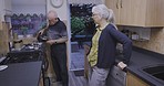 Elderly, morning and senior couple talking by a stove ready for drinking coffee at home. House, marriage and retirement of old people with communication and care together with happiness