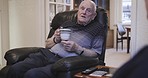 Coffee, conversation and senior couple in the lounge for morning communication, relax and retirement. Calm, talking and elderly man speaking to a woman in living room with tea at a nursing home