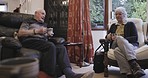 Retirement, senior couple and morning coffee in living room, discussion and stress relief for wellness and bonding. Love, romance or old man with mature woman, tea or romantic in lounge for happiness