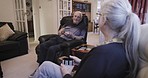 Retirement, senior couple and morning coffee in living room, conversation and planning with happiness. Love, romance and old man with mature woman, drinking tea and discussion for memories in lounge
