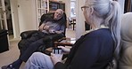 Love, senior couple and drinking coffee in lounge, talking and happiness with retirement, memories and relationship. Romance, old man and senior woman on couch, chatting and relax together with tea