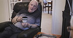 Senior man, coffee and rehab in conversation, discussion or consultation at home on sofa with caregiver. Elderly male talking about rehabilitation, progress or health to woman counselor or nurse
