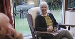 Senior woman, home and elderly couple love in retirement with a smile and care together. Living room, tea drink and happy discussion in a lounge sitting with happiness and loving conversation 