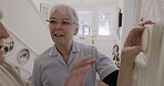 Retirement, thermostat and control with a woman nurse showing a man patient the temperature dial in his home. Assisted living, heating or switch with a female medicine professional and male resident