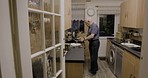 Senior man, kitchen and breakfast cooking of a elderly person with vegetables and eggs on a stove. Home, health food and diet recipe of a chef in retirement with apron and ingredients at a house