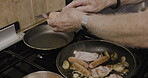 Hands, food and cooking breakfast with a senior man in the kitchen of his retirement home in the morning. Bacon, eggs and sausage in a pan for a fried meal of nutrition in a house from above
