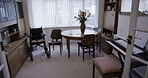 Room, furniture or wheelchair in empty house, nursing home or dining room by table, desk or piano keyboard. Chairs, help or retirement disability aid in property, real estate or relax interior design