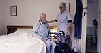 Nurse, wheelchair and senior man in bedroom for healthcare, disability assistance and medical support. Nursing home, retirement and caregiver helping sick, disabled and elderly patient from bed