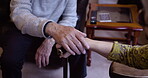 Hands, hope and senior couple in care, support and grief due to cancer in retirement home with comfort. Elderly, old and closeup of mature people with trust or respect and walking stick as help