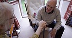 Love, help and senior couple holding hands during a conversation for support, help and trust. Communication, care and elderly man and woman with affection while talking in a nursing home together