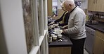 Senior couple, cooking together in retirement and food with lifestyle, wellness and nutrition with healthy meal. Help, love and care in marriage, old man and woman in kitchen, trust and retired 