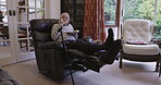 Retirement, elderly and man eating food and relax sitting on a couch or sofa resting, break and enjoying a snack. Senior, pensioner and old person is retired holding a plate in a house