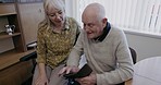 Old couple, cellphone and relax in home on social media, internet and online news app. Senior people, mobile phone and connect in living room, house and notification on technology, network and search