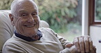 Face, happy and disability with a senior man in the living room of his home, sitting on the sofa. Portrait, smile and cane with a mature retired male feeling positive or excited alone in his house
