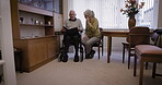 Photo album, senior couple and memory support for dementia, Alzheimer and disability in nursing home. Retirement people or woman with disabled partner reading history book for conversation or talking